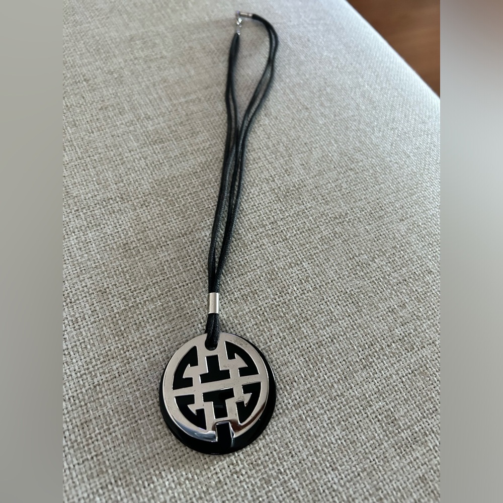 Purchased in Beijing. Beautiful leather band, silver necklace.